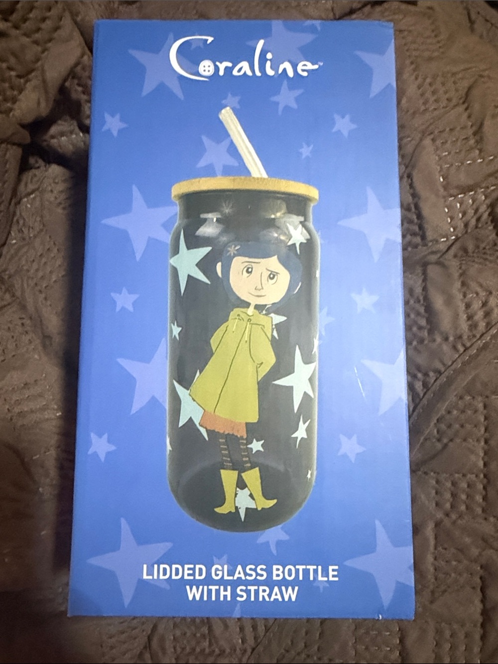 Purple Glass Bottle with Character Print and Yellow Lid